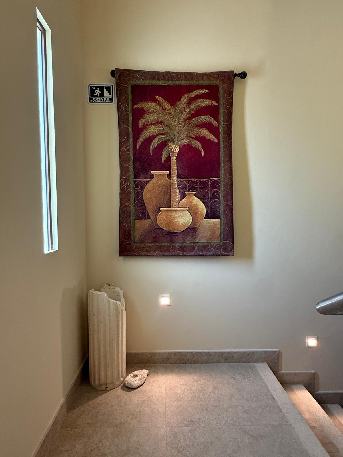 Palm tapestry in the stairwell landing