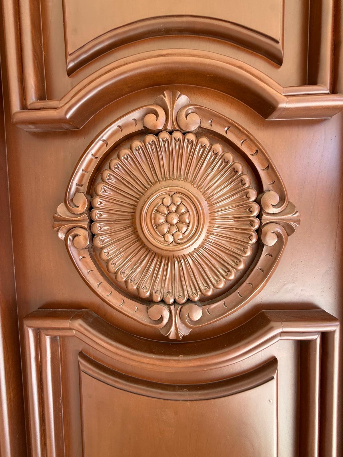 Carved rosette medallion on the entry door