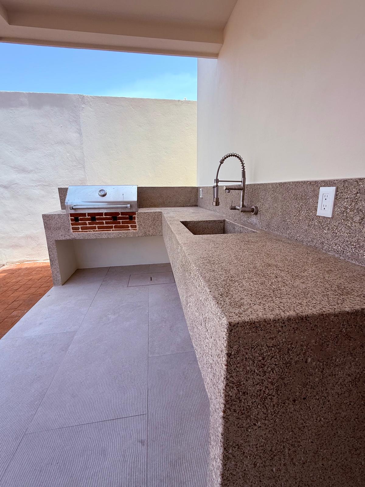 Outdoor grill station with terrazzo counter and sink