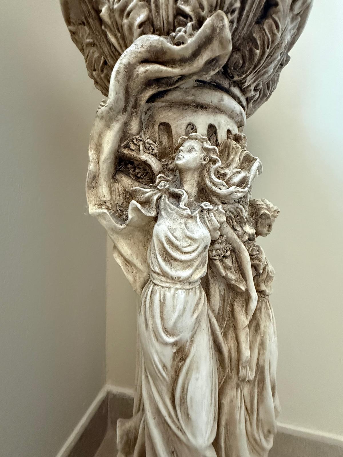 Carved classical figure column detail