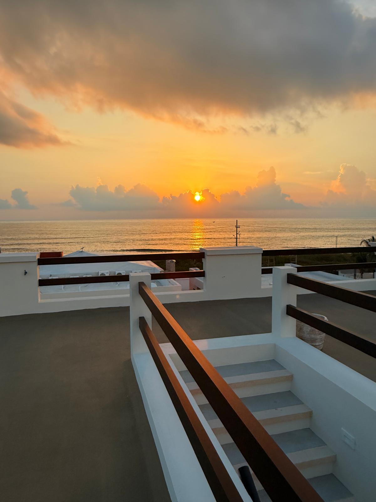 Sunrise over the Caribbean from the rooftop terrace stairway