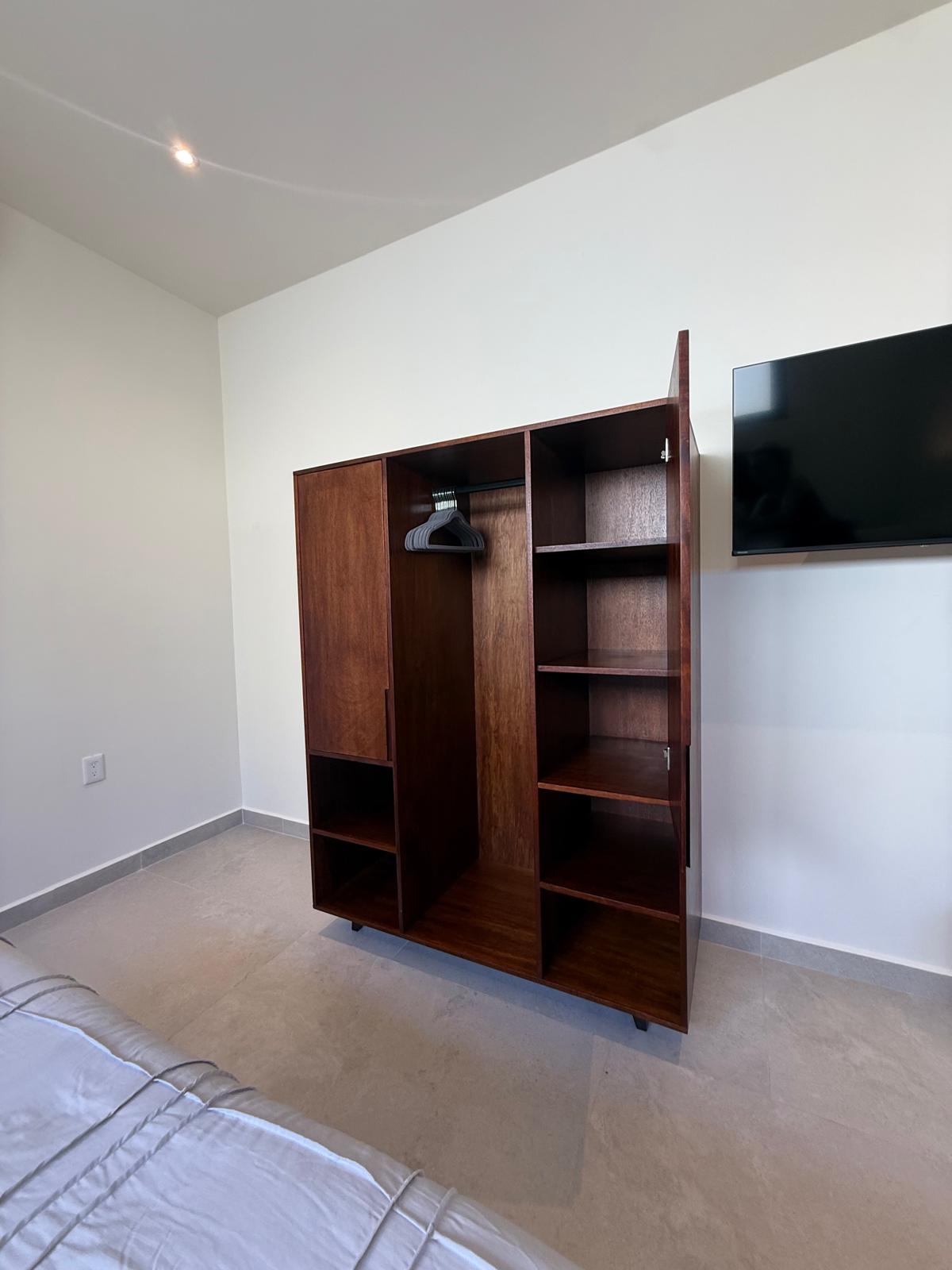 Guest room wardrobe and wall-mounted television