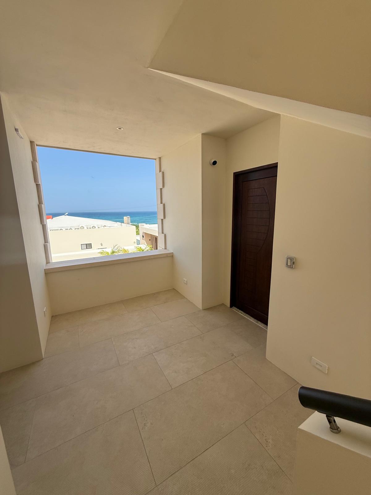 Landing with picture window overlooking the Caribbean Sea