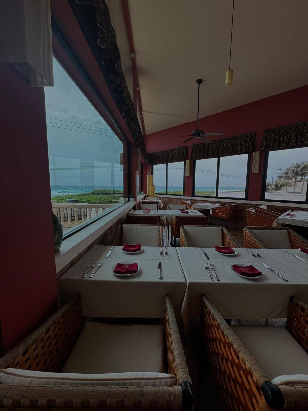 Ristorante dining room with panoramic windows framing the Caribbean