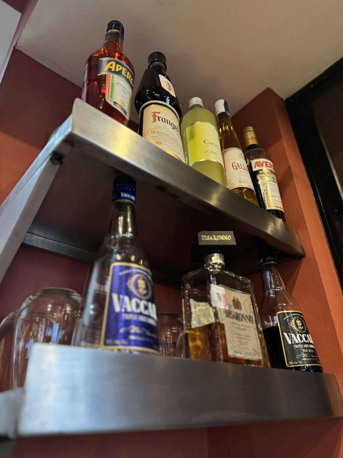Shelf of Italian aperitivi and liqueurs at the bar